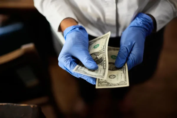 Dentist holding money
