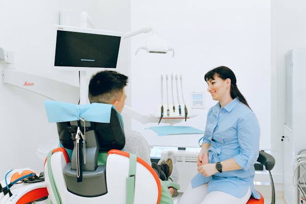 Dentist talking with patient